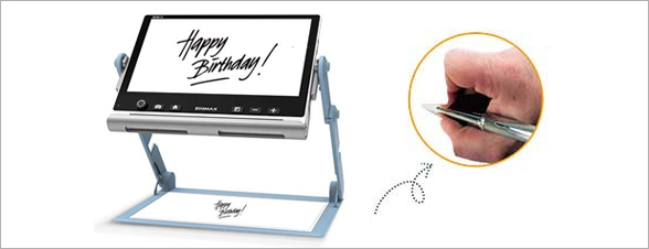 Photo représentant la vidéloupe avec le texte Happy birthday écrit par l'utilisateur à partir du support de la loupe.